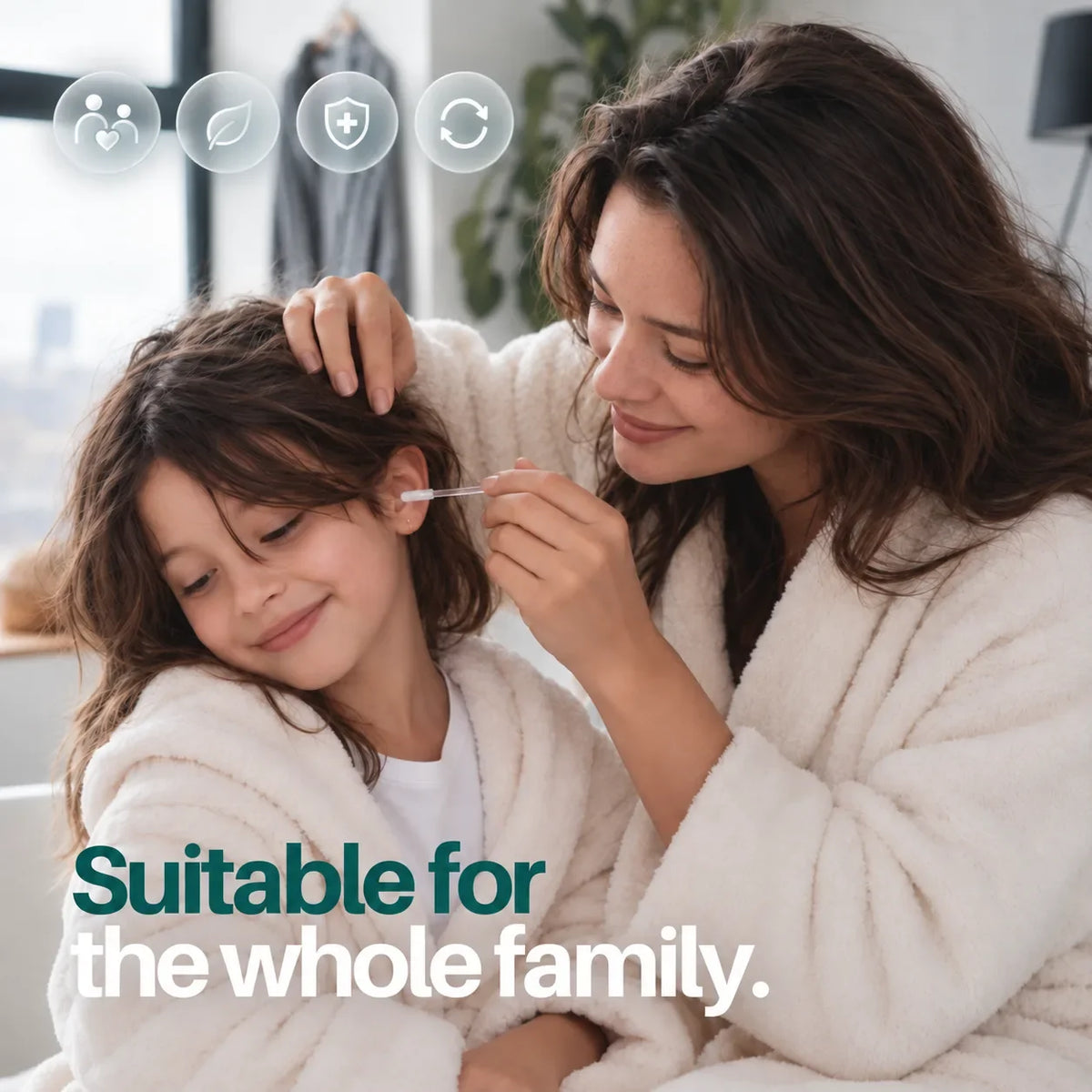 A mother gently caring for the outer ear of her smiling young daughter in a bright bathroom