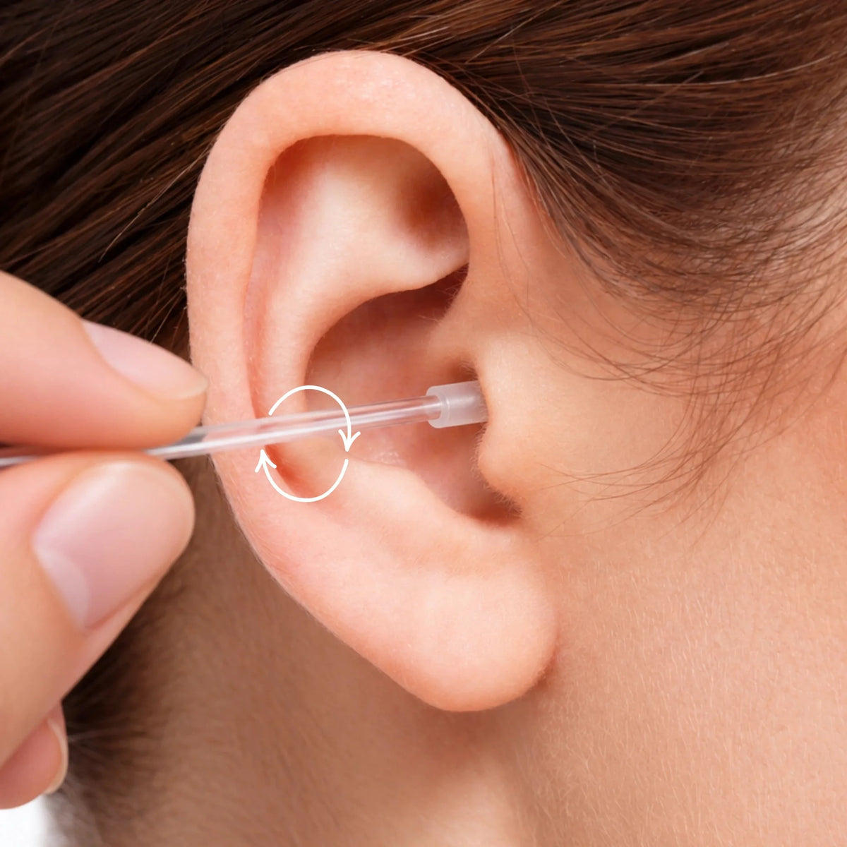 Close-up of an ear with a soft silicone ear cleaner at the outer opening of the ear